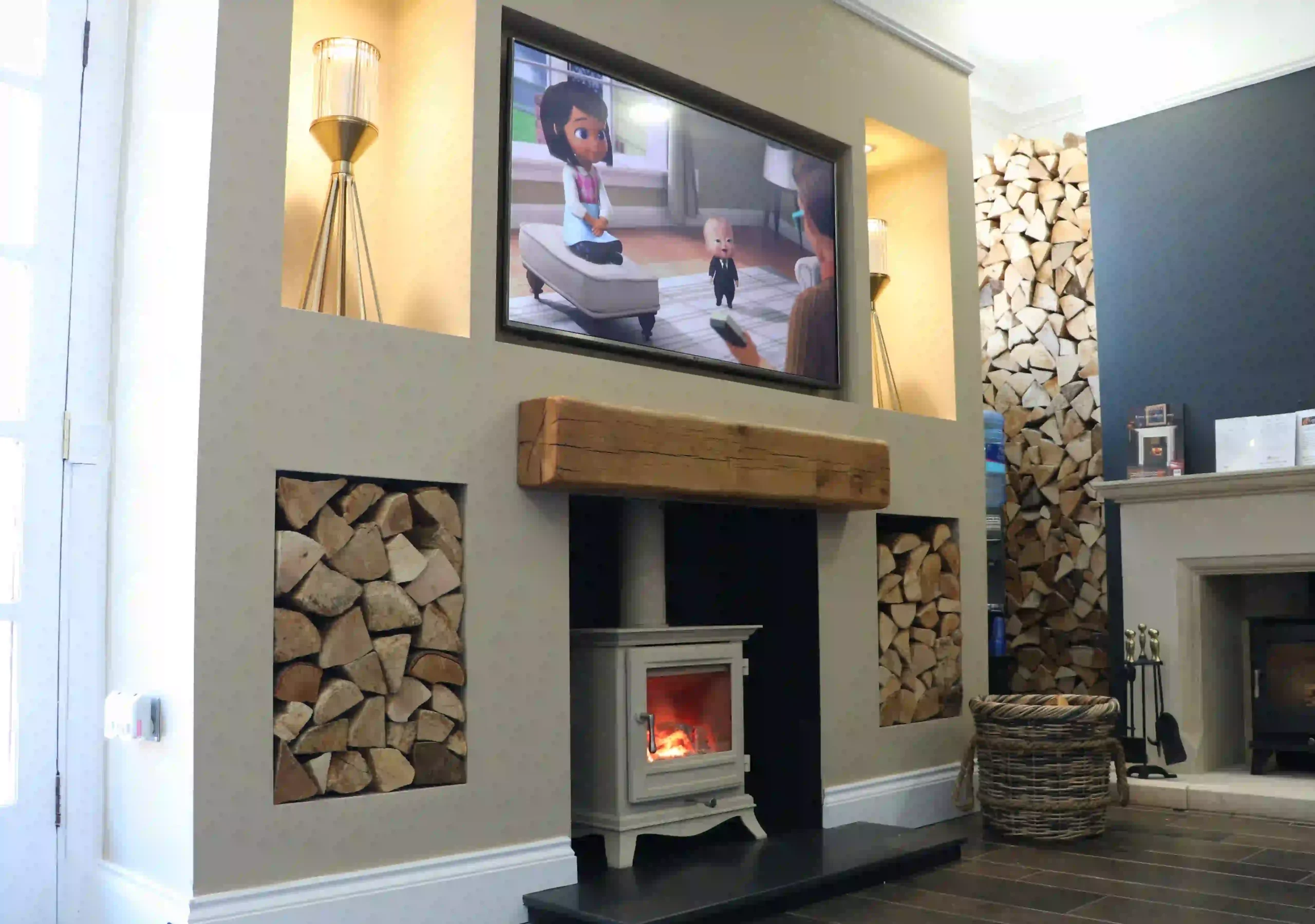 Media wall with a log burner