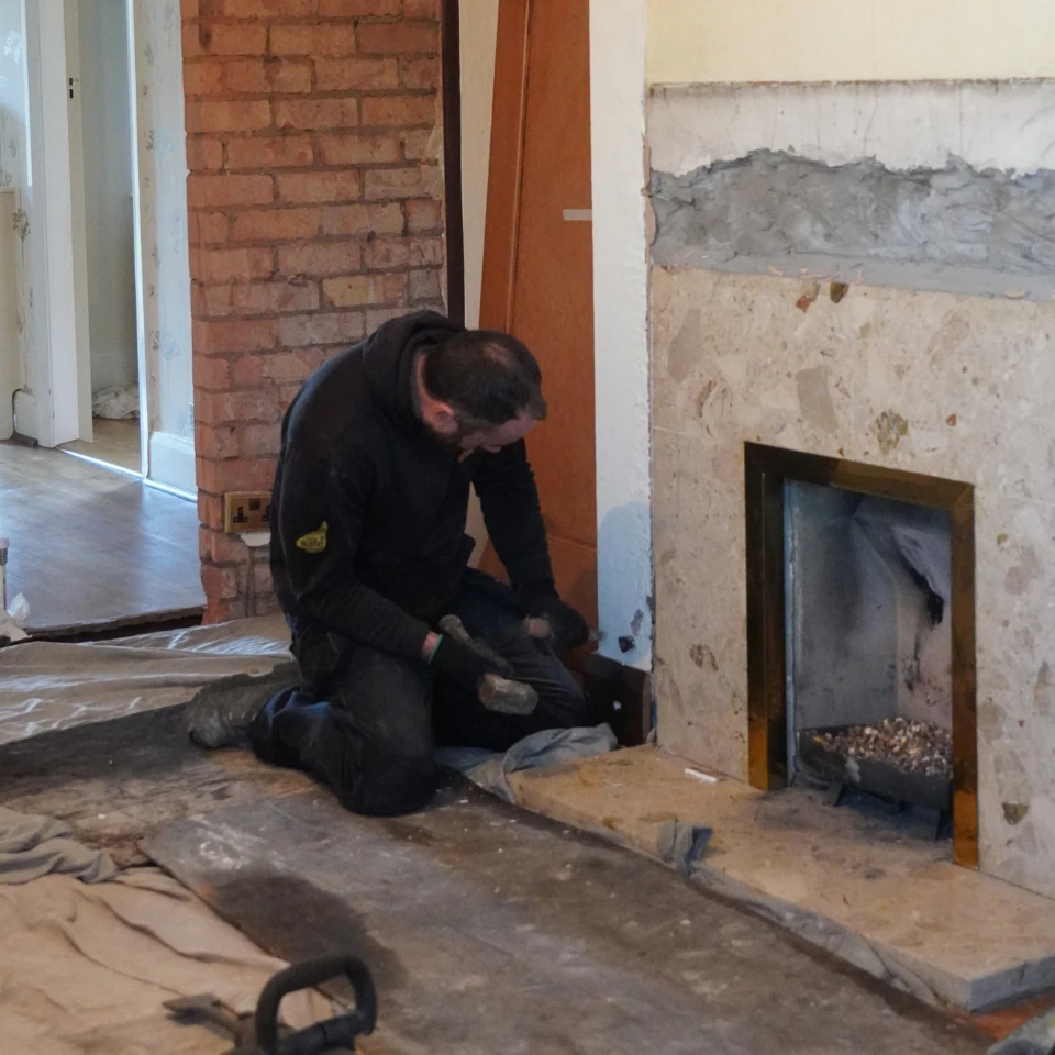 wood burner installer fitting stove - removing old fire