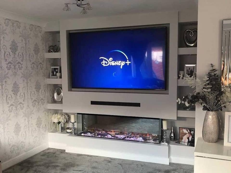 Electric fire media wall with sound bar and alcoves