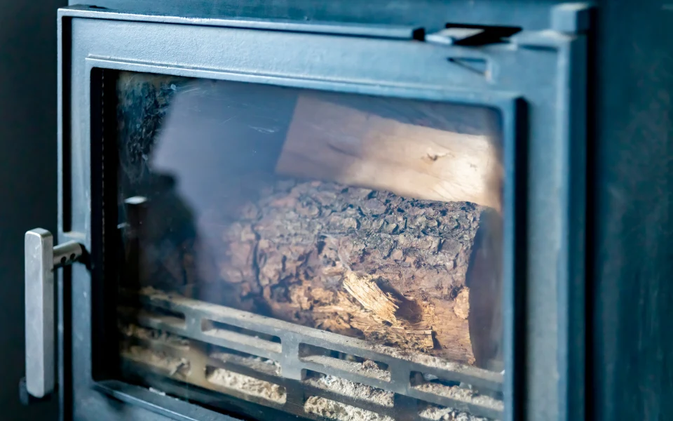 stove cleaning services. Image of wood burner