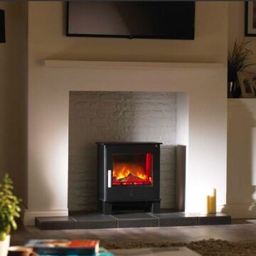 ACR Malvern Electric Stove on cream wall with a candle