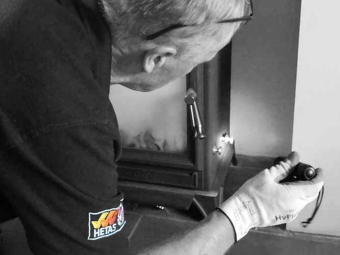 experienced hetas installer dave installing fire
