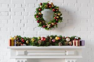 A fireplace decorated for christmas