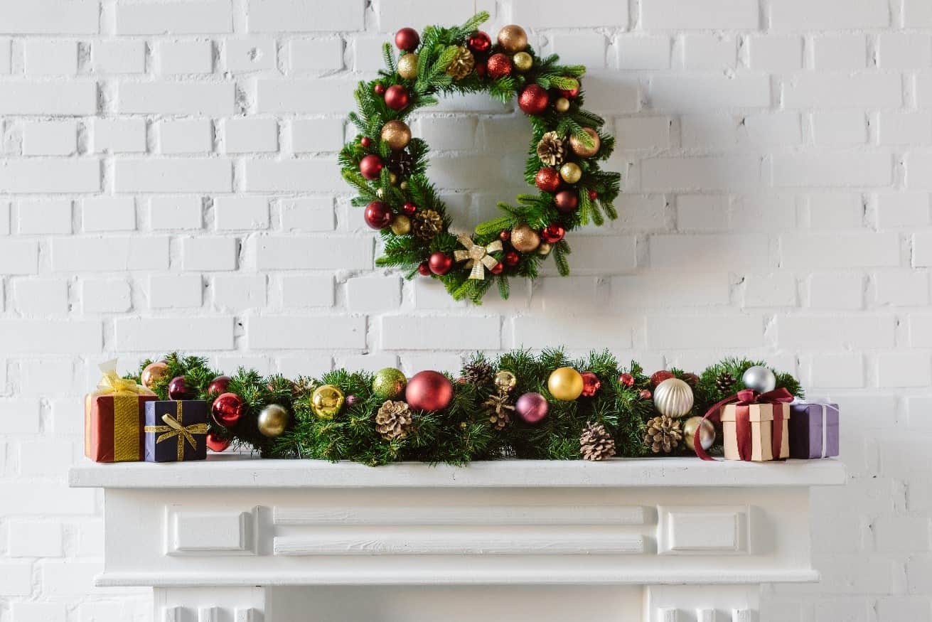 A fireplace decorated for christmas