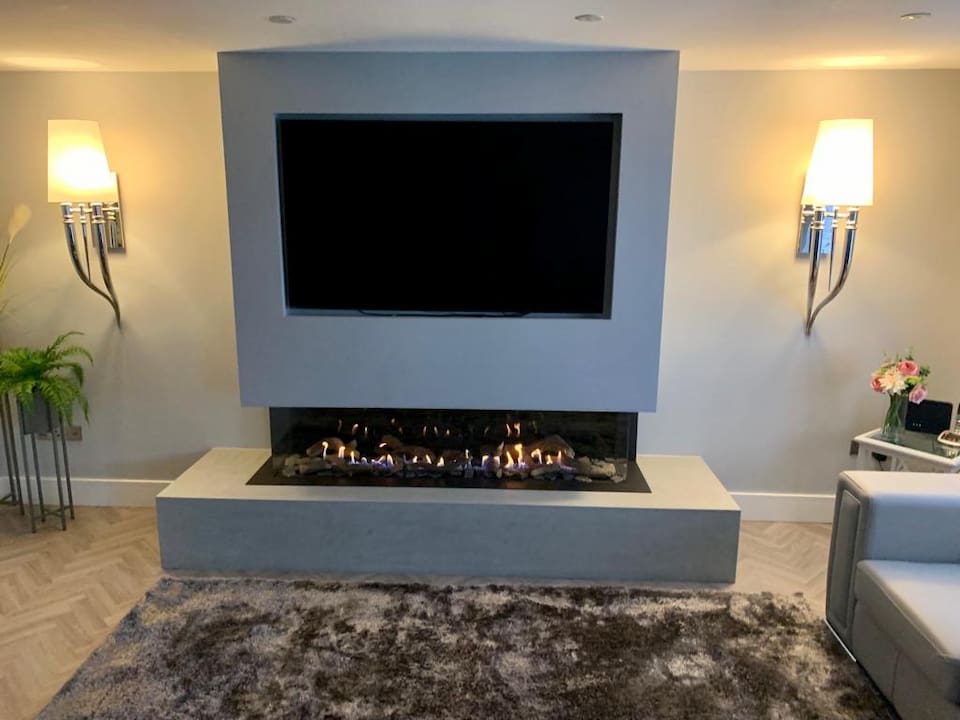 Gas fire media wall chimney breast